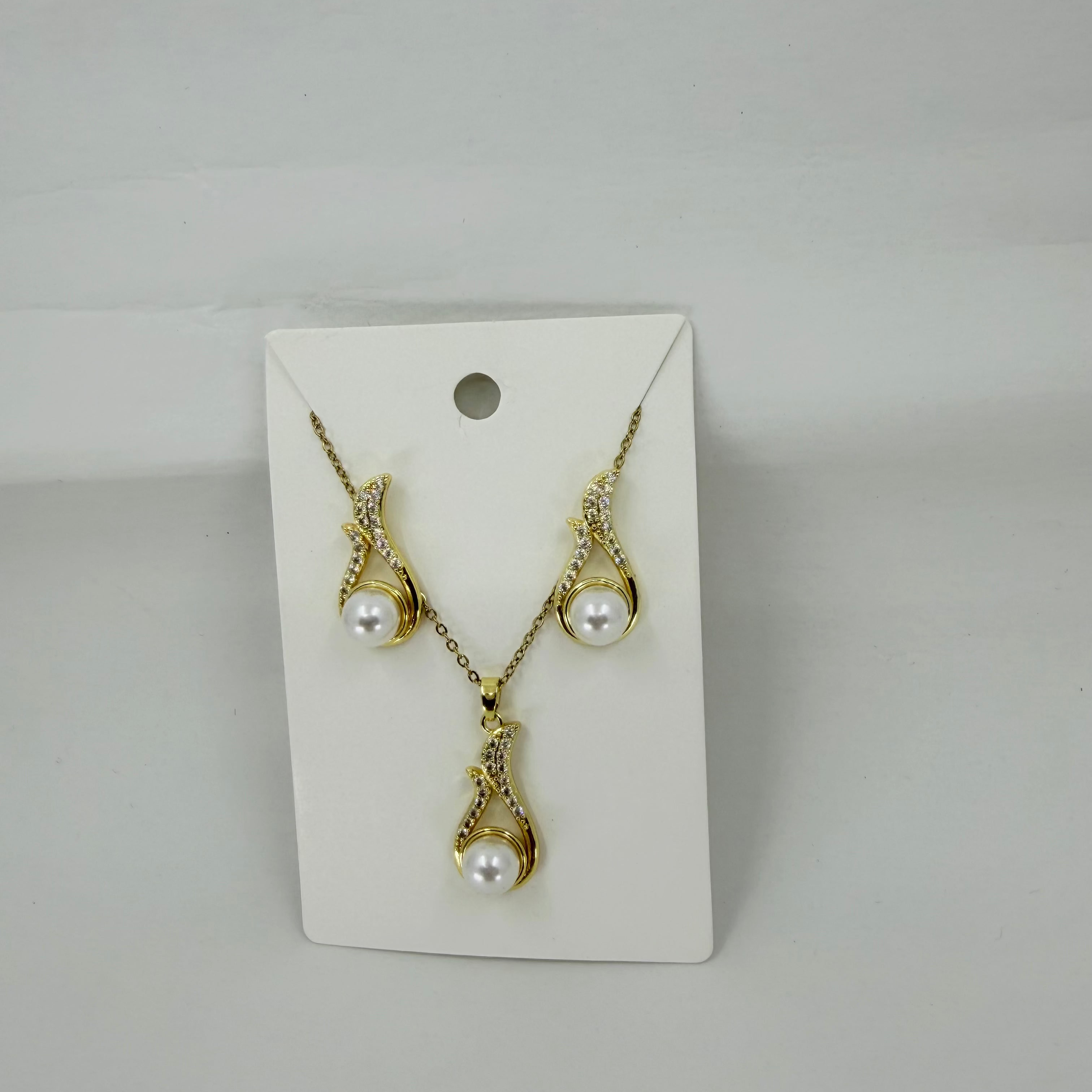 Shop Wholesale Gold-tone necklace and matching drop earrings with white faux pearls