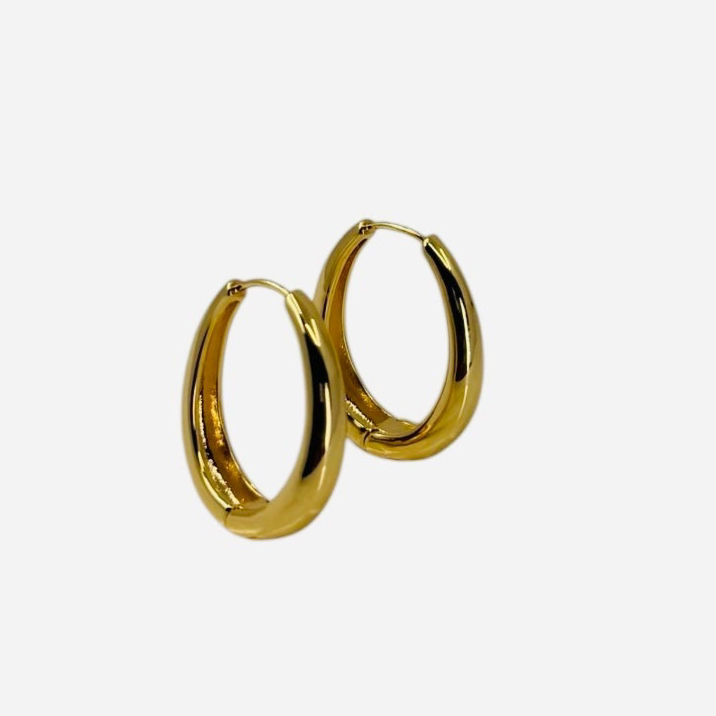 18K gold plated over brass, these polished oval hoop earrings feature a sleek, refined design with a smooth, high-shine finish.
