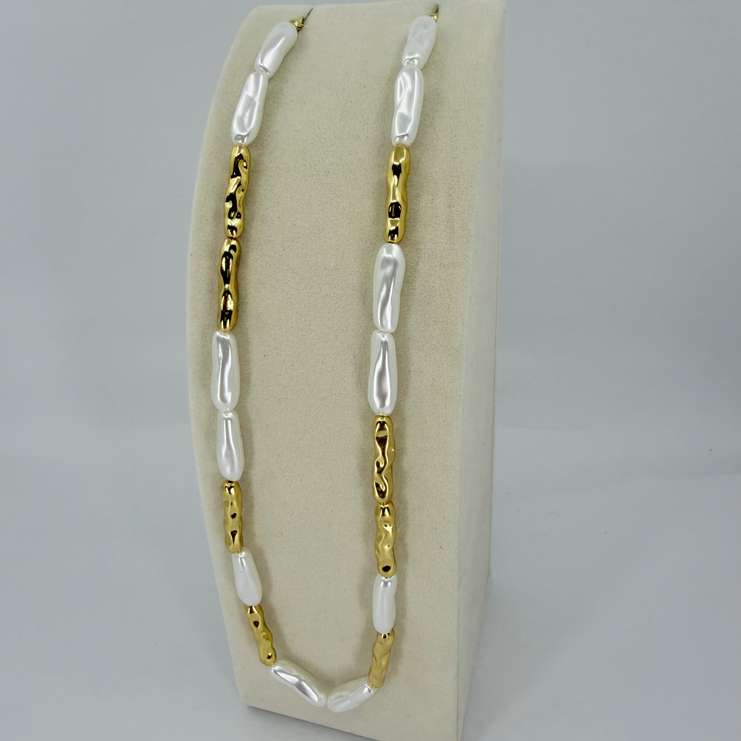 18K gold plated over brass, the Liquid Pearl Beaded Necklace offers a modern take on classic elegance.
