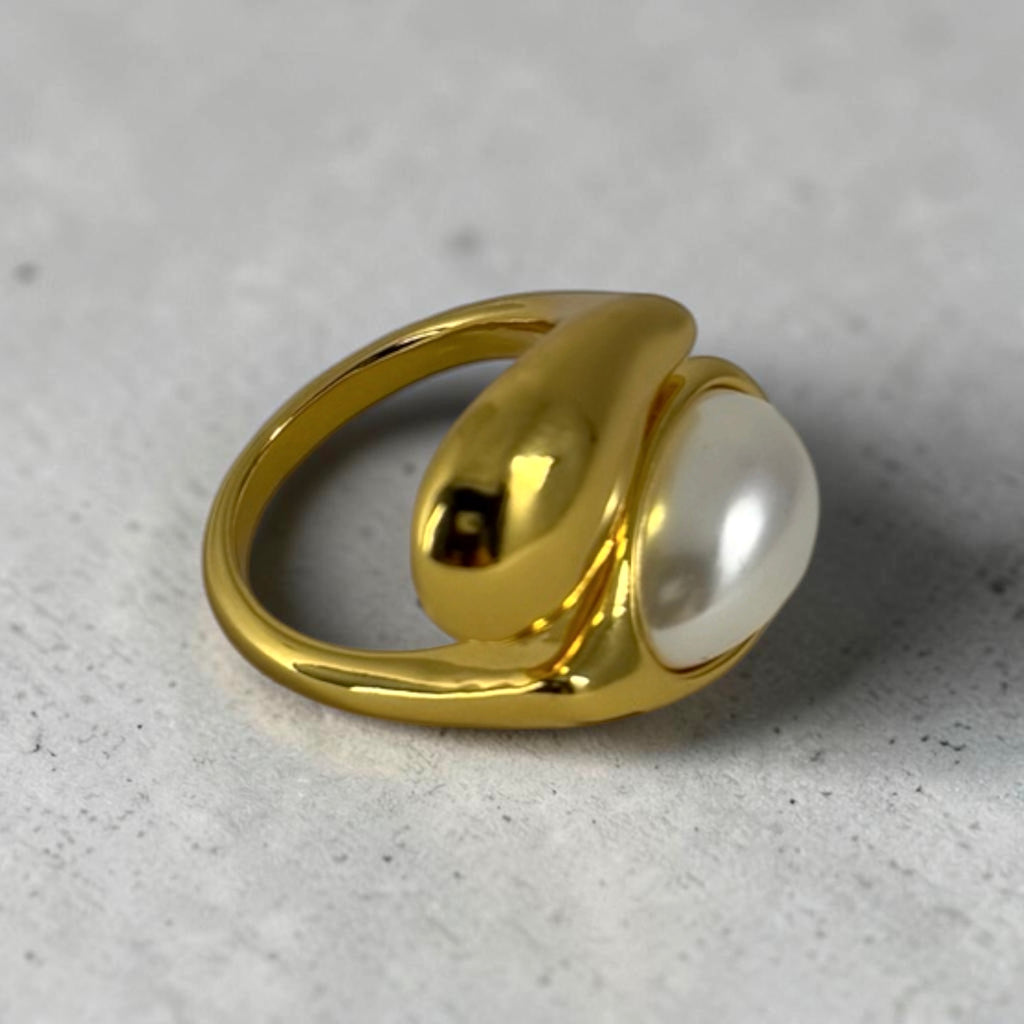 "Close-up of elegant teardrop pearl ring"