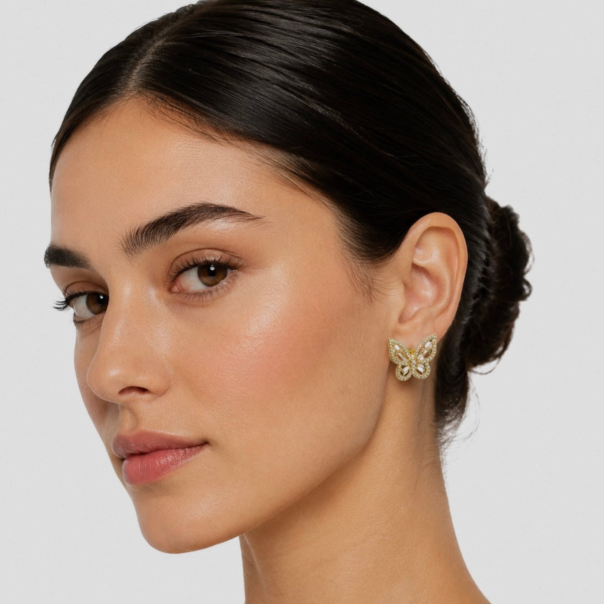 Woman wearing a butterfly earring 
