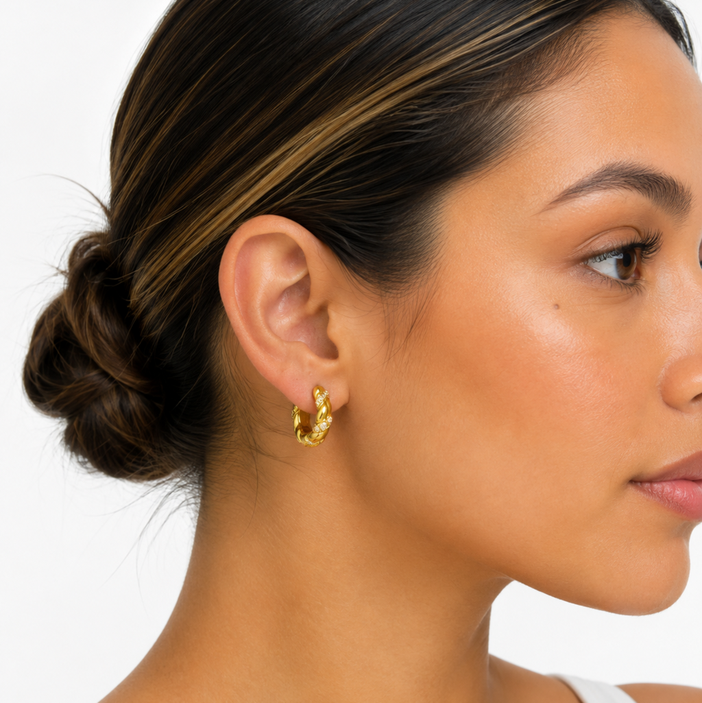 Twisted minimalist huggie earrings adorned with Zc