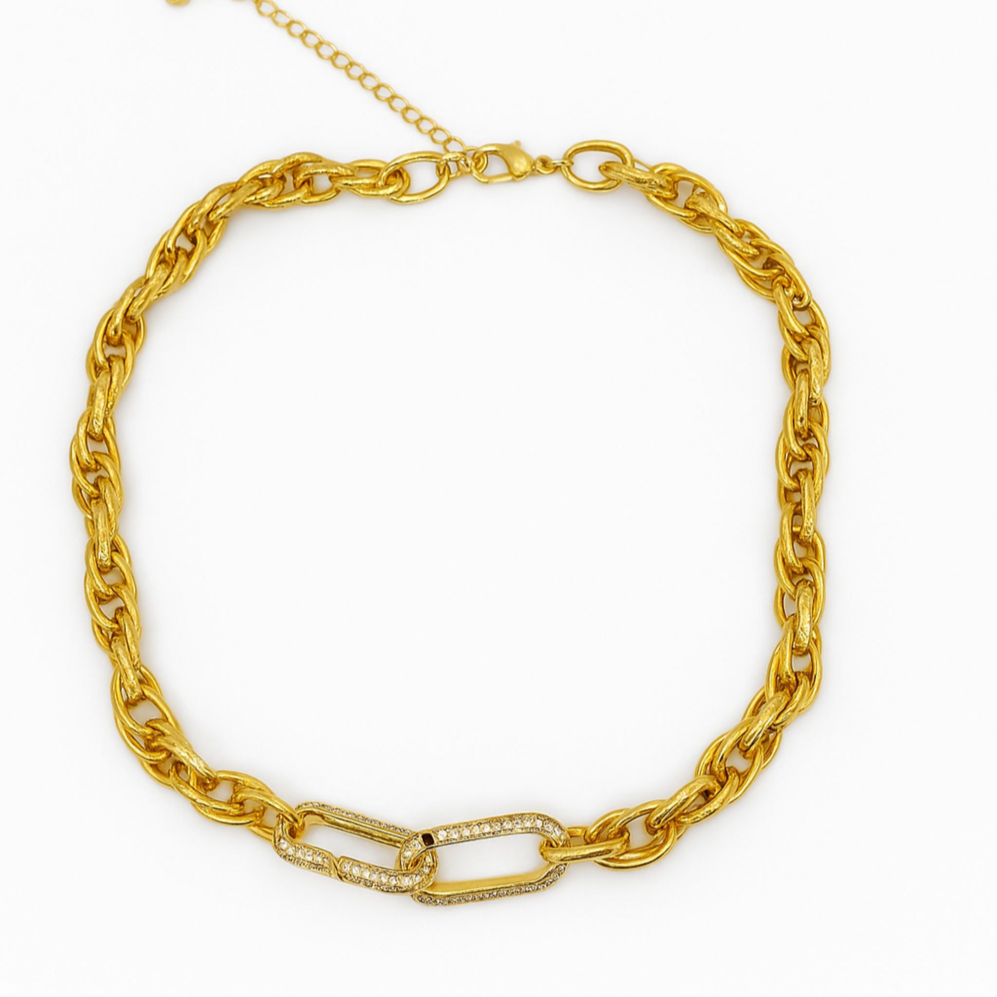Gold chain necklace on a white background
