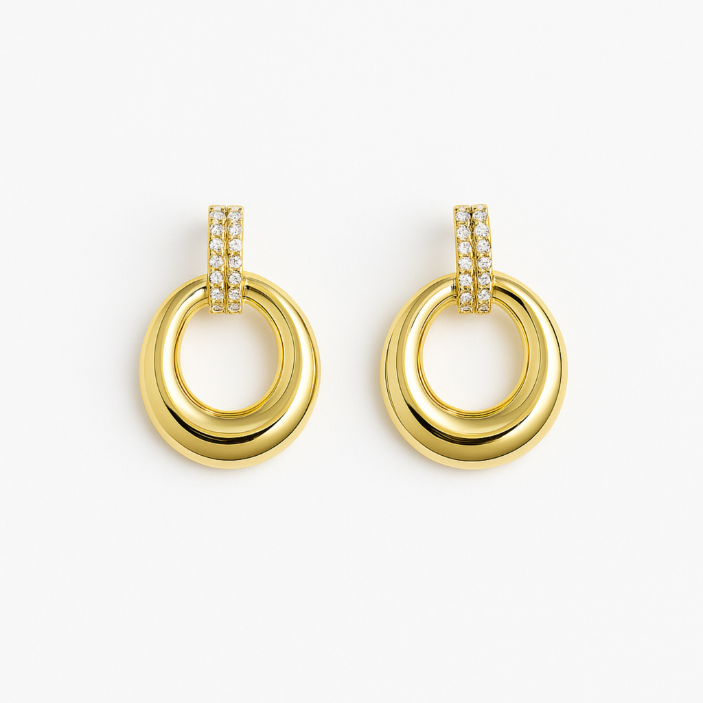 Gold hoop earrings with diamond accents on a white background