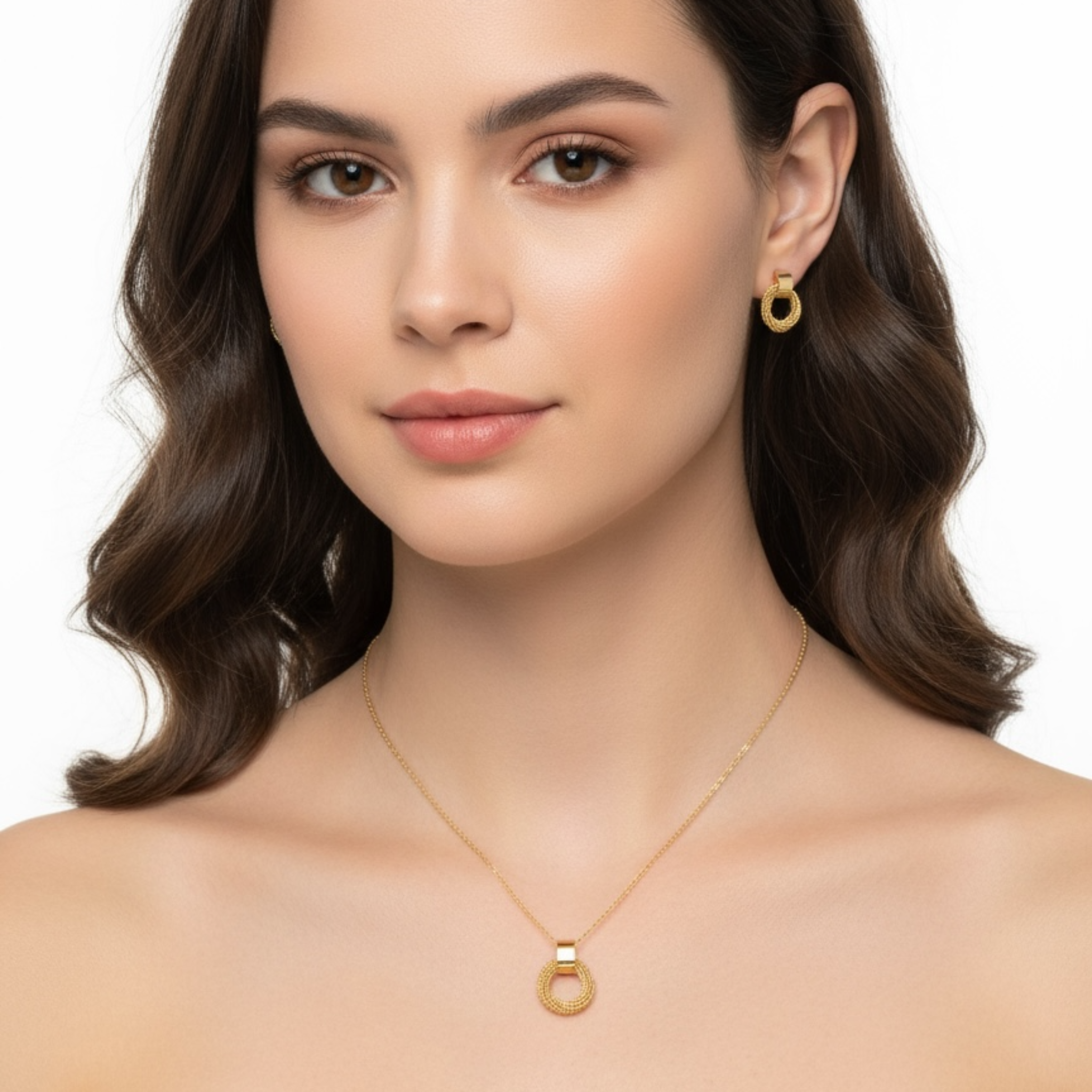 Woman wearing gold necklace and earrings on a white background