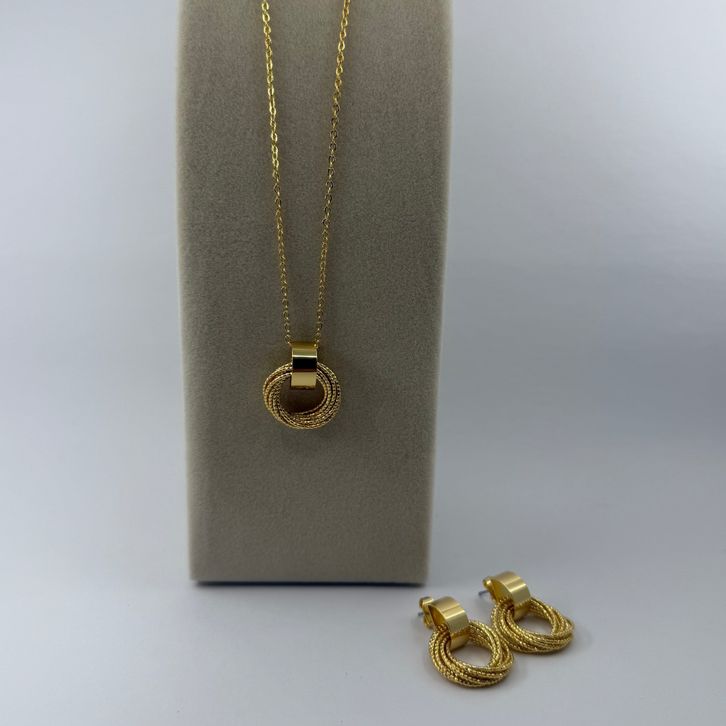 18K gold plated over brass, the Golden Circle Jewelry Set Earrings & Necklace,  brings effortless shine to a clean, modern design.