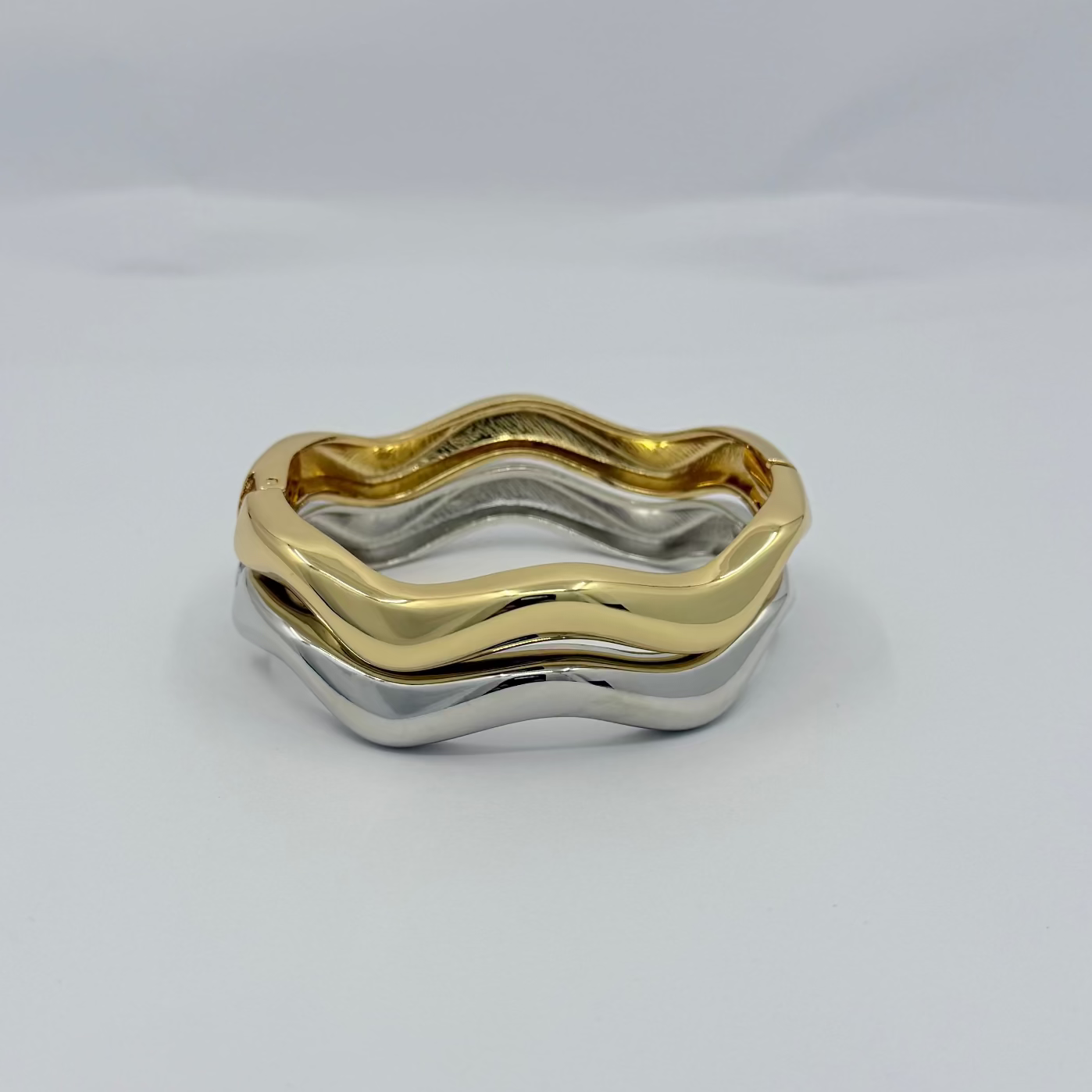 Two-tone gold and silver ring on a white background