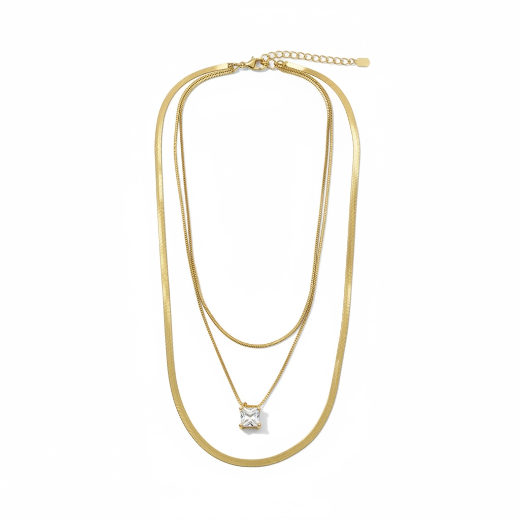 Gold necklace with a star-shaped pendant on a white background