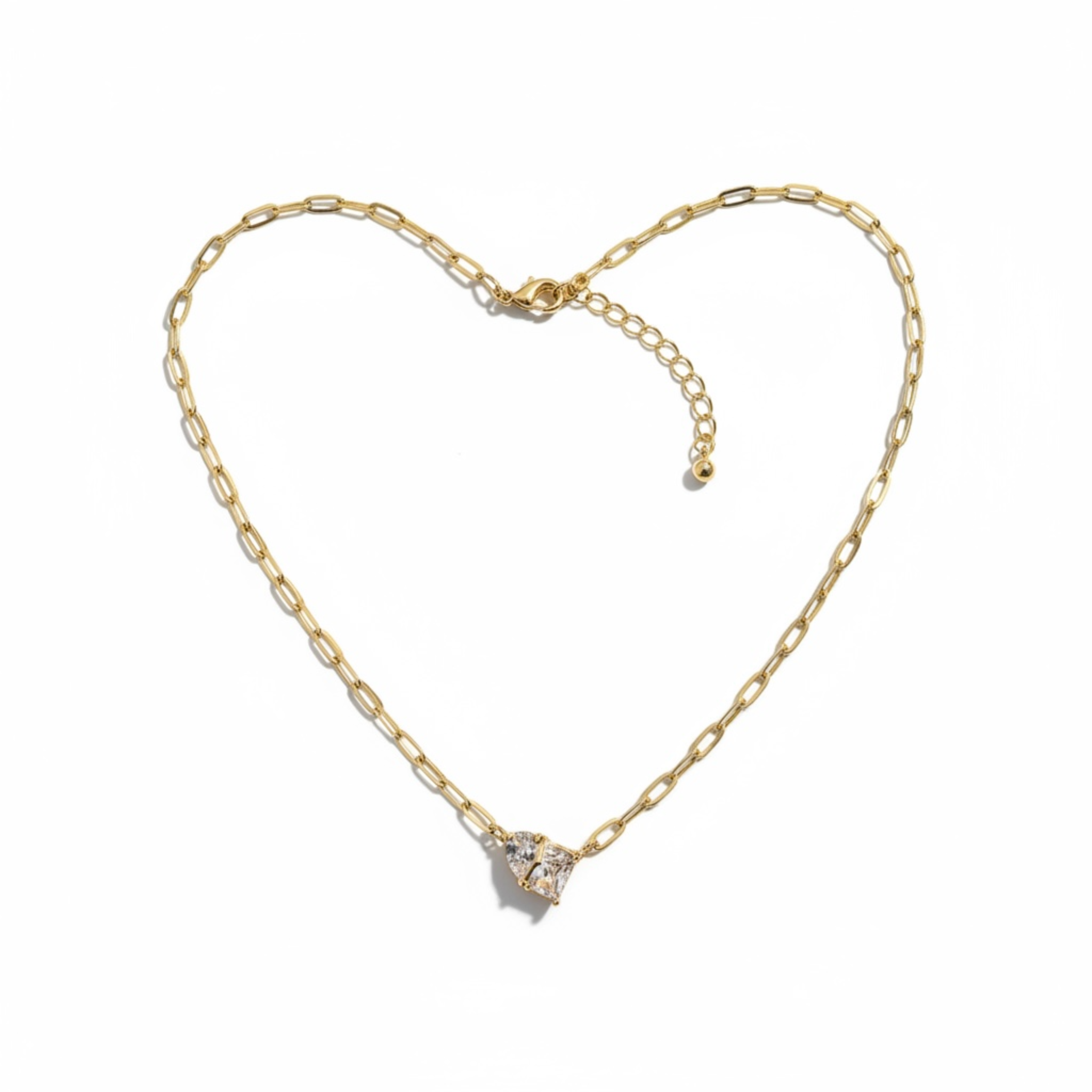 Gold necklace with a heart-shaped clasp on a white background