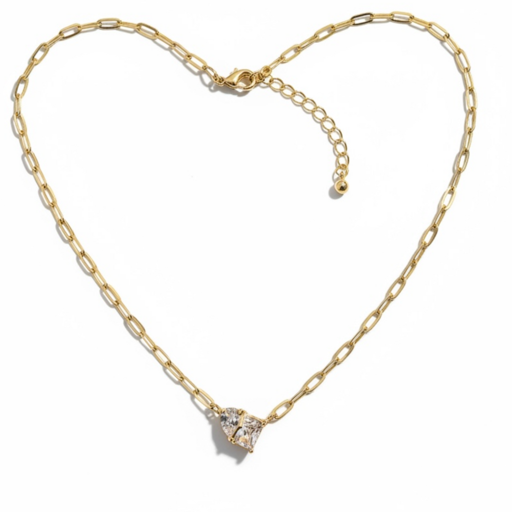 Gold necklace with a heart-shaped clasp on a white background