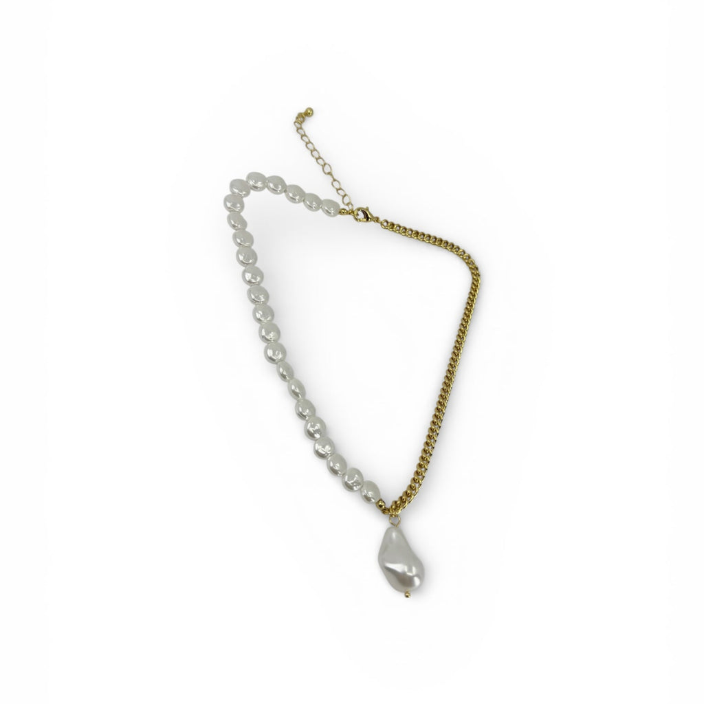 18K gold plated over brass, the Baroque Pearl Fusion Necklace blends classic elegance with a bold, modern edge.

