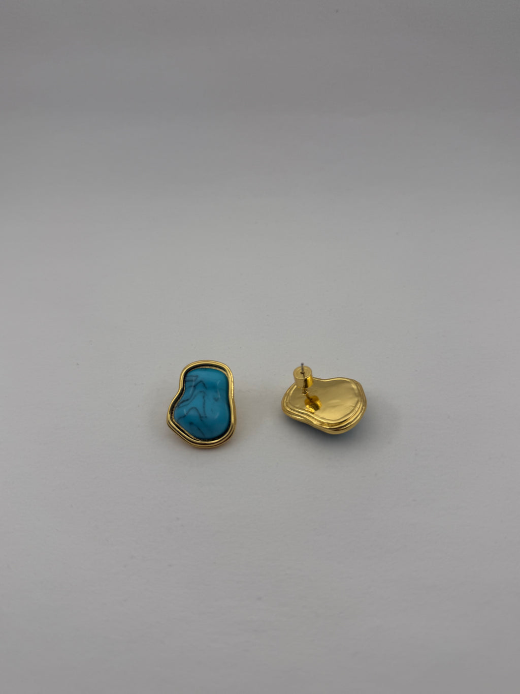 "Baroque-inspired turquoise earrings side view"